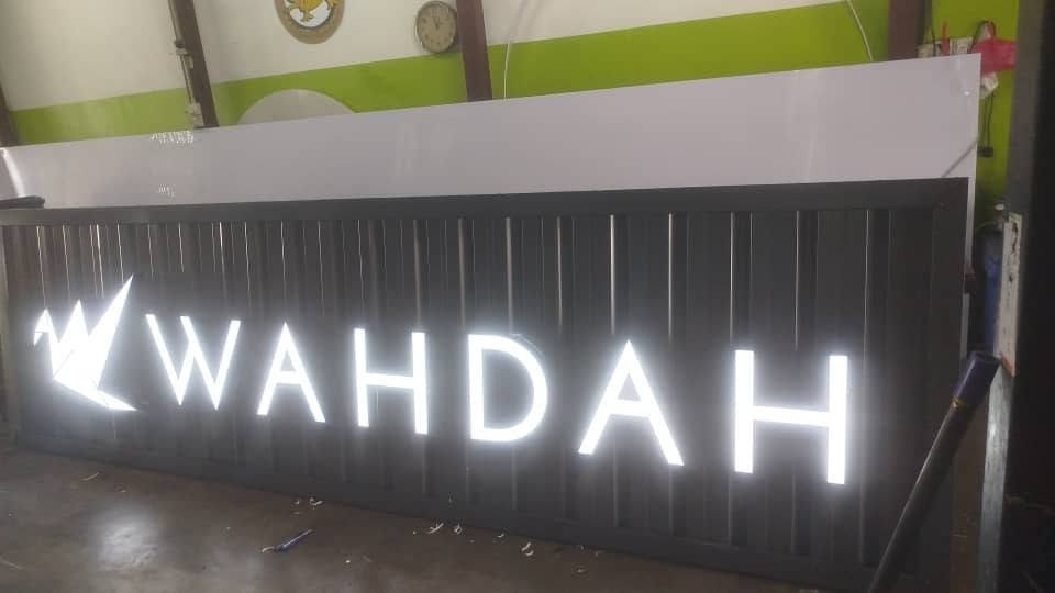 Illuminated WAHDAH LED logo sign
