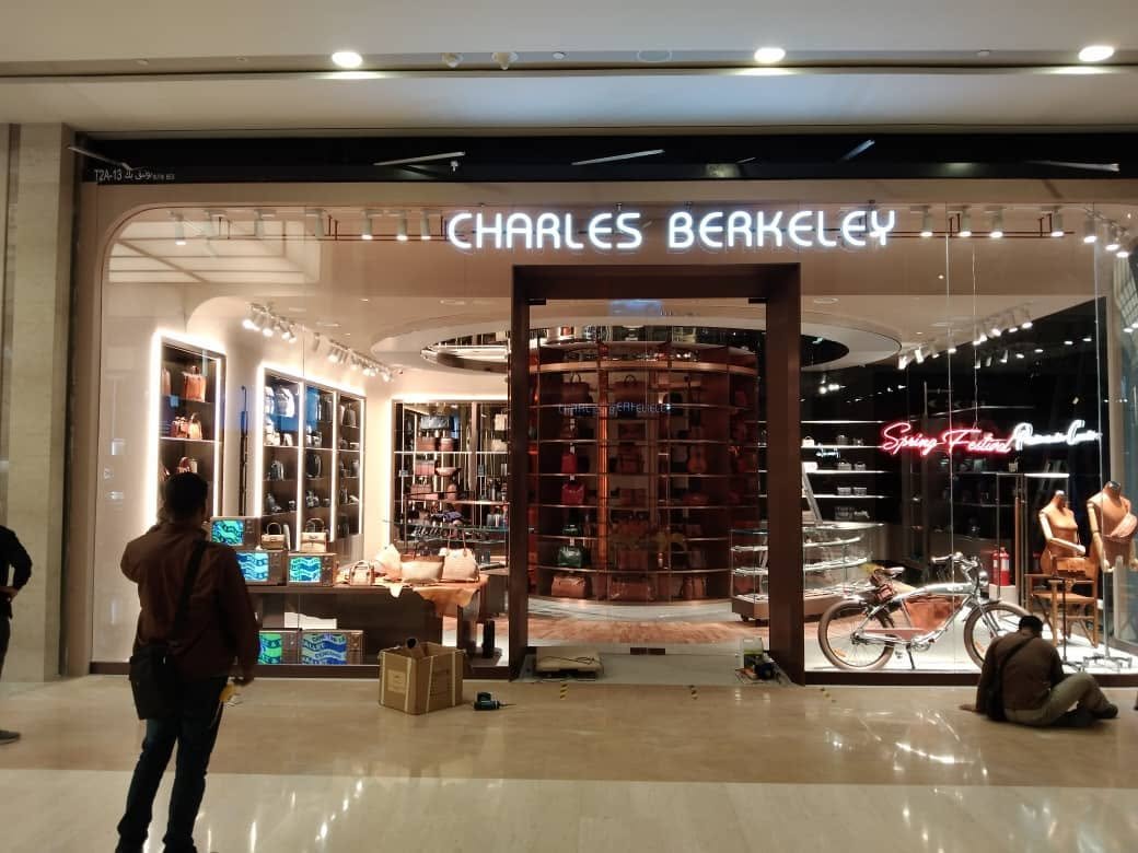 Charles Berkeley illuminated retail storefront sign