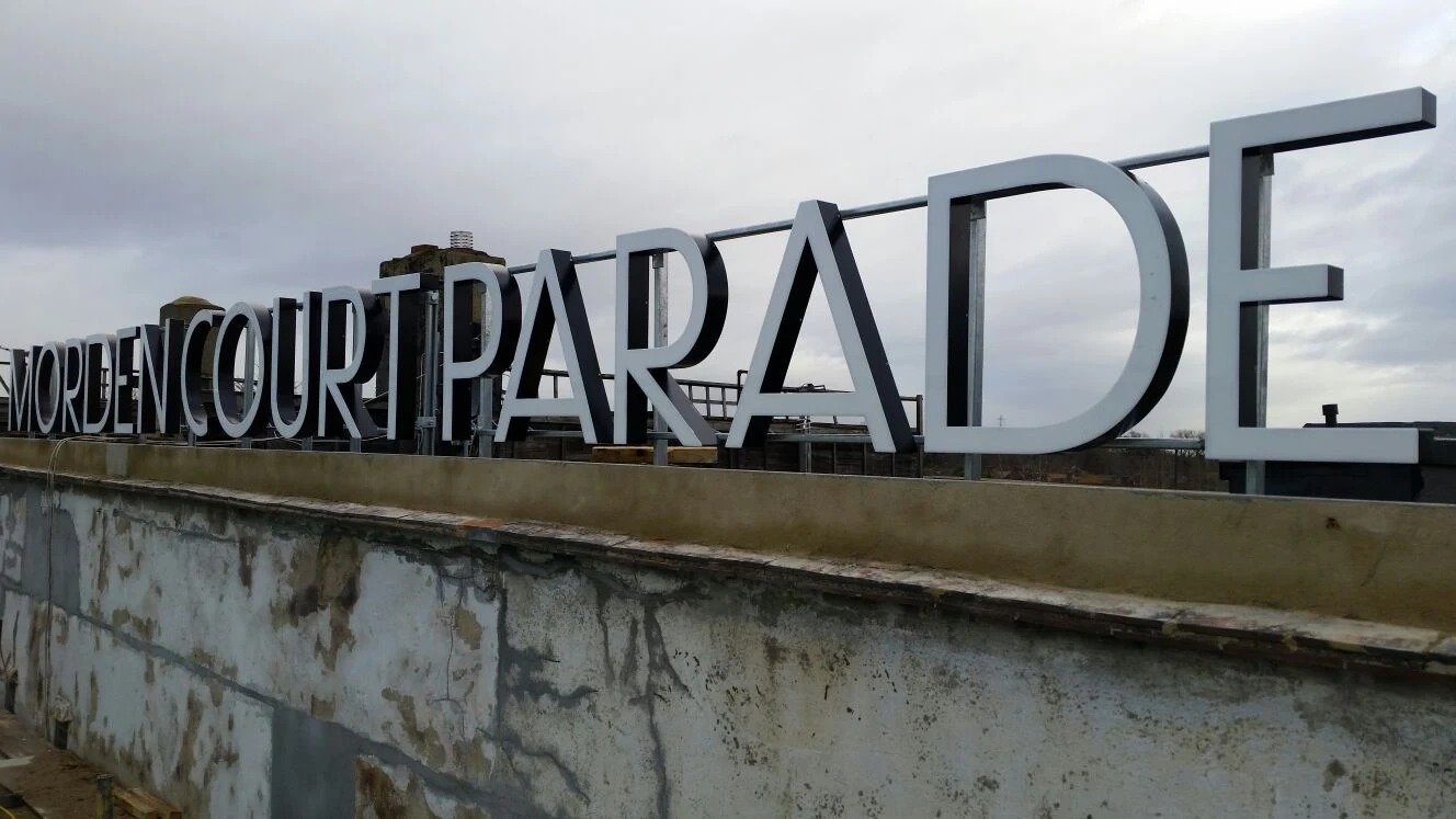 Morden Court Parade rooftop building signage